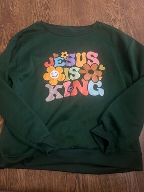 Green Sweatshirt with Colorful "Jesus Is King" Graphic